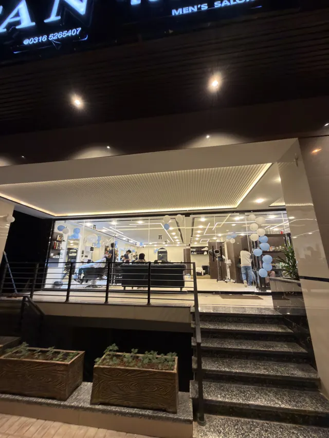 The steps up to the glass front at night