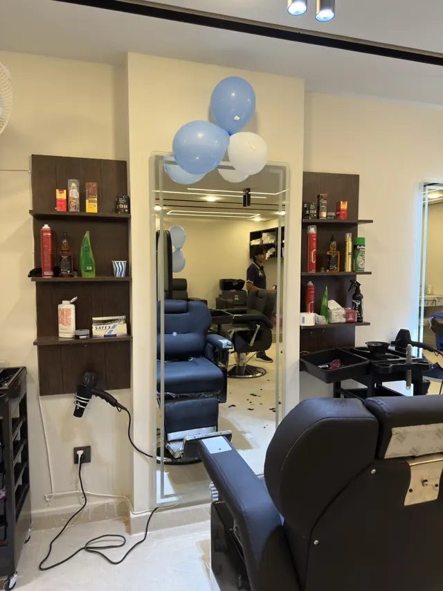 Another barber station with its mirror and shelves